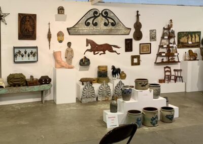 Salon-style wall of antique and vintage collectibles